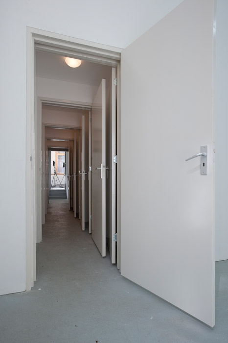 Monika Sosnowska, Entrance, 2003. Lights, doors, white emulsion paint, chipboards, Dimensions variable, Courtesy of Juan and Patricia Vergez Collection