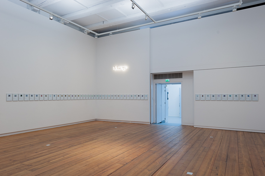 Matthieu Laurette, THINGS (Purchased With Funds Provided By)&nbsp;2010 - 2020, Installation composed of a series of 50 contracts and a neon sign. <em>fotograaf: Cassander Eeftinck Schattenkerk</em>
